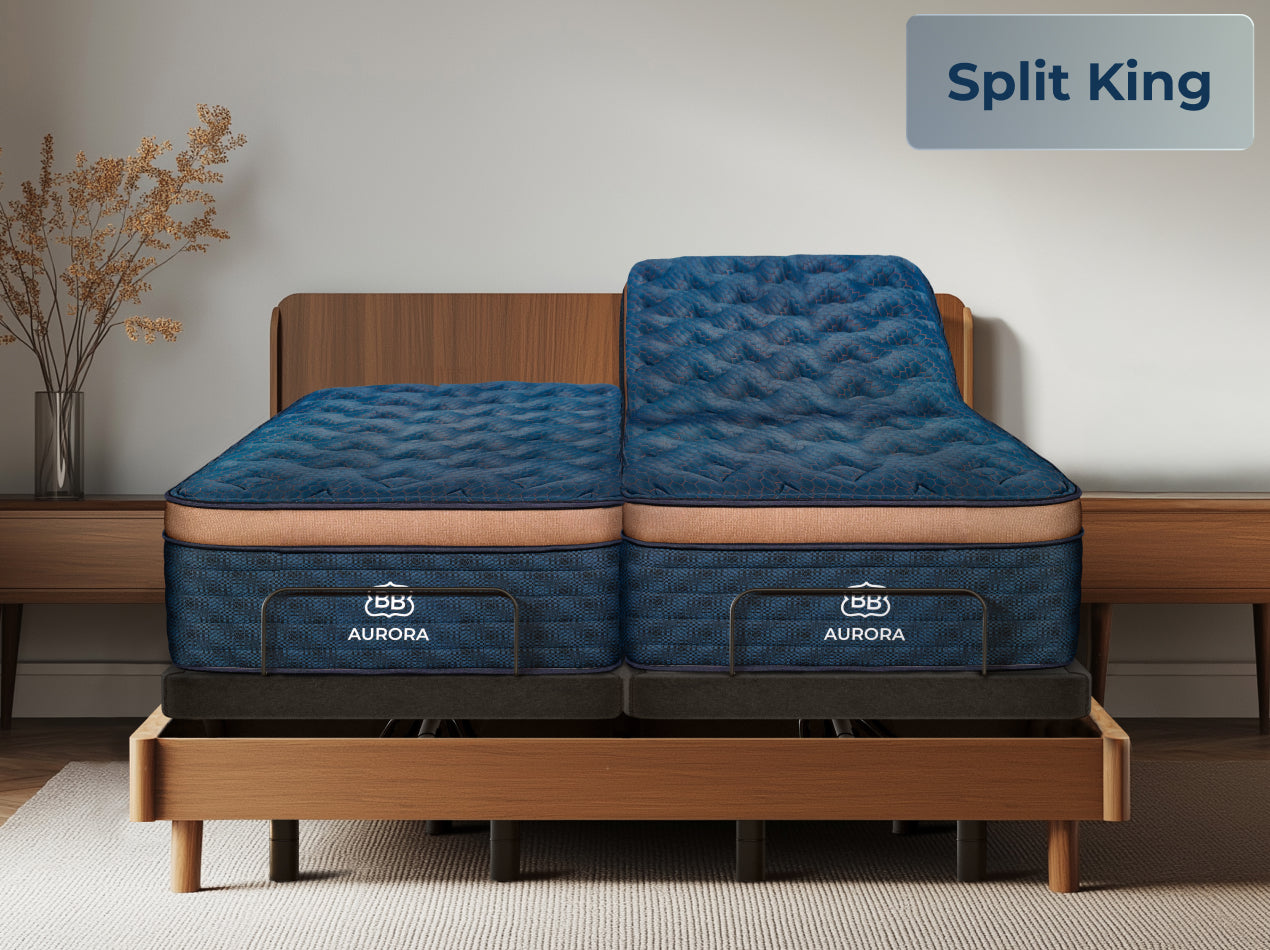 Two blue mattresses on split Ascension® Ultra Adjustable Power Bases in a wood bed frame, with one side raised and a “Split King” label in the corner.